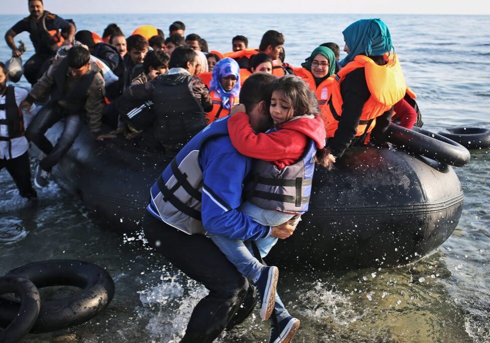 Syrian refugees come in on a boat from Turkey, in Mytilene, on the island of Lesbos, Greece on Friday, October 9th, 2015. Once refugees get processed and get papers after their arrival in Lesbos, they can exchange money and buy ferry tickets to get to Athens.(Photo credit/Tara Todras-Whitehill for IRC) 